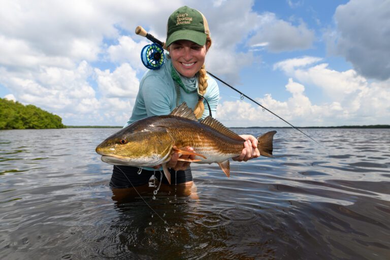 Female fly angler with a big redfish