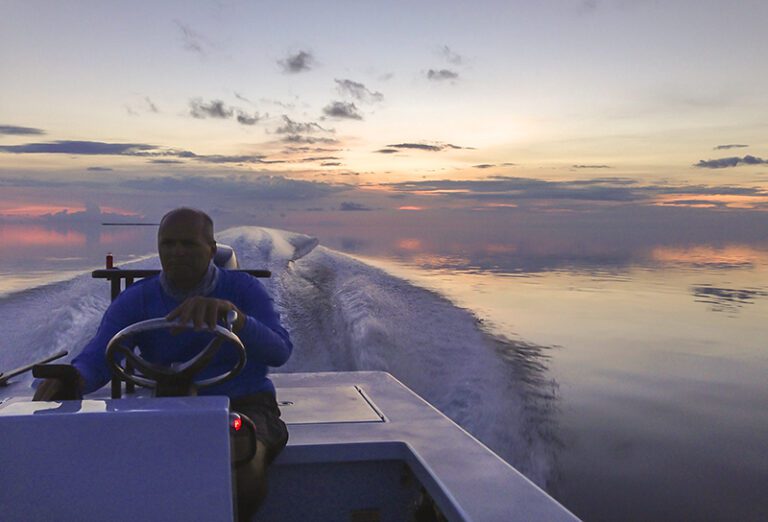 Man Driving Fishing Boat
