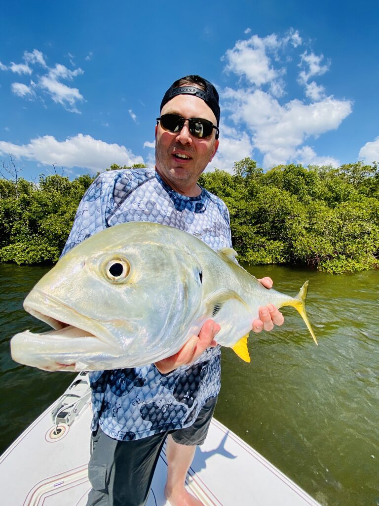 Man Holding Fish Close Up