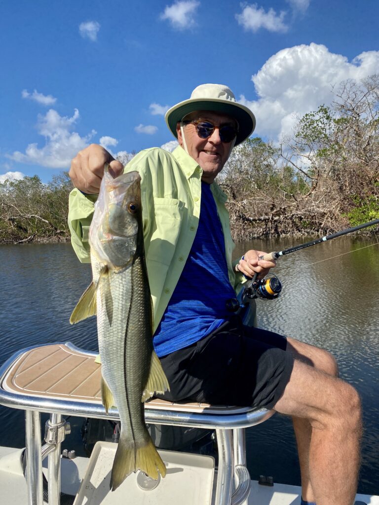 Old Man Holding Fish