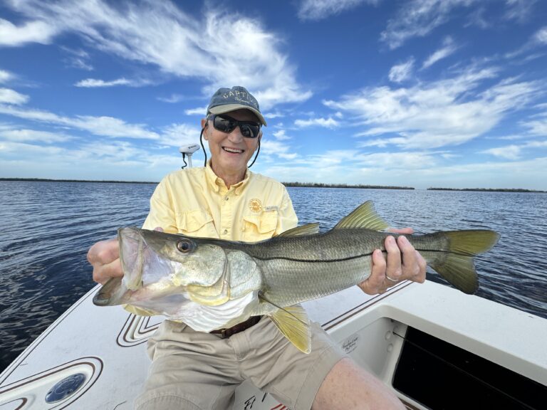 Senior Holding Big Fish